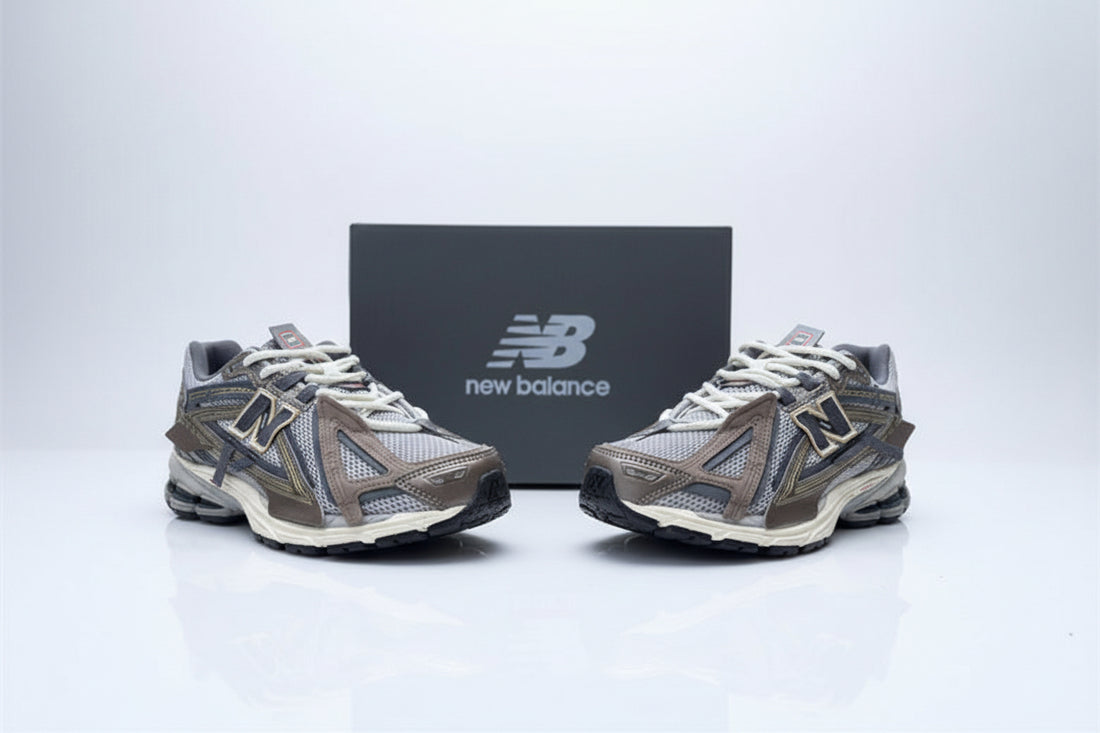 Pair of New Balance running shoes on a concrete surface with a box in the background.