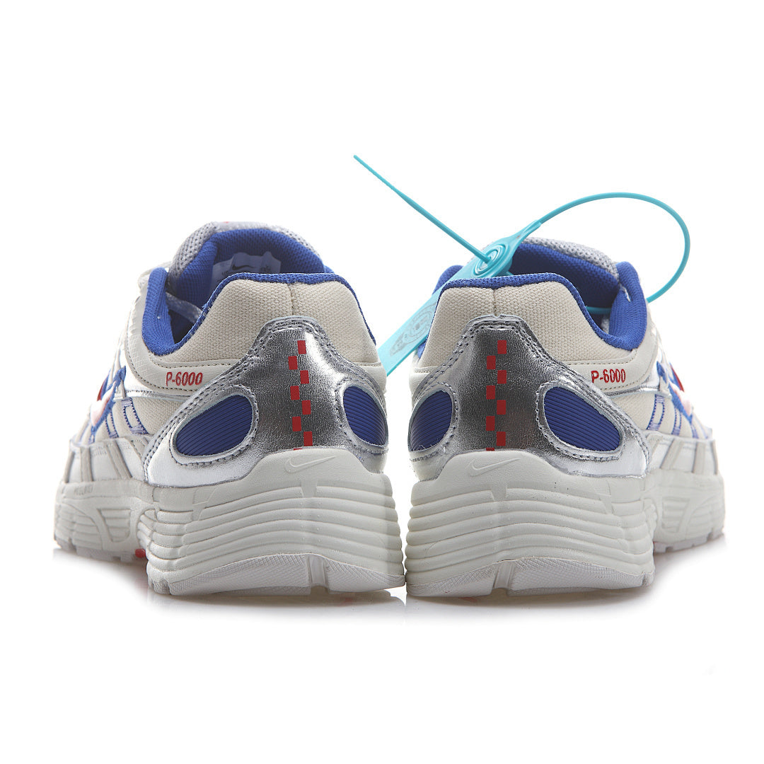 Silver and red sneaker with a unique pattern on a white background