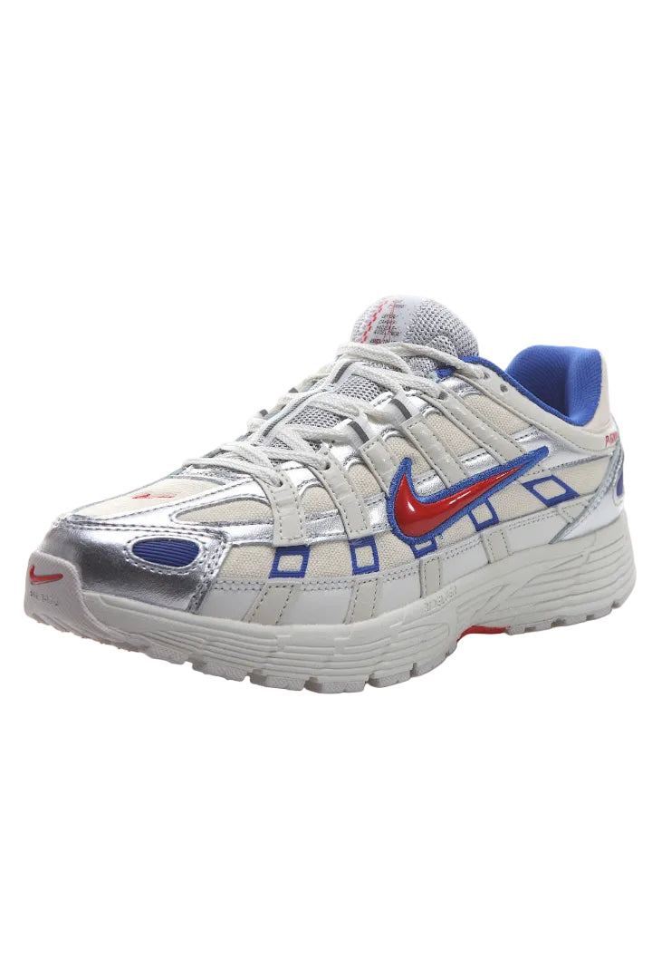 Silver and red sneaker with a unique pattern on a white background
