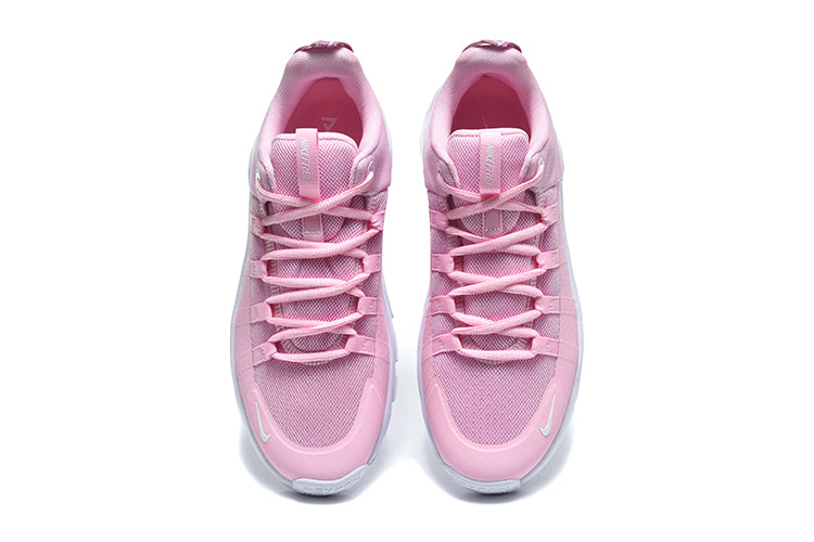 Pink athletic shoe with white sole on a white background